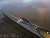 racing kayak, wing paddle, calm lake