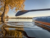 stand up paddleboard on lake with fall colors